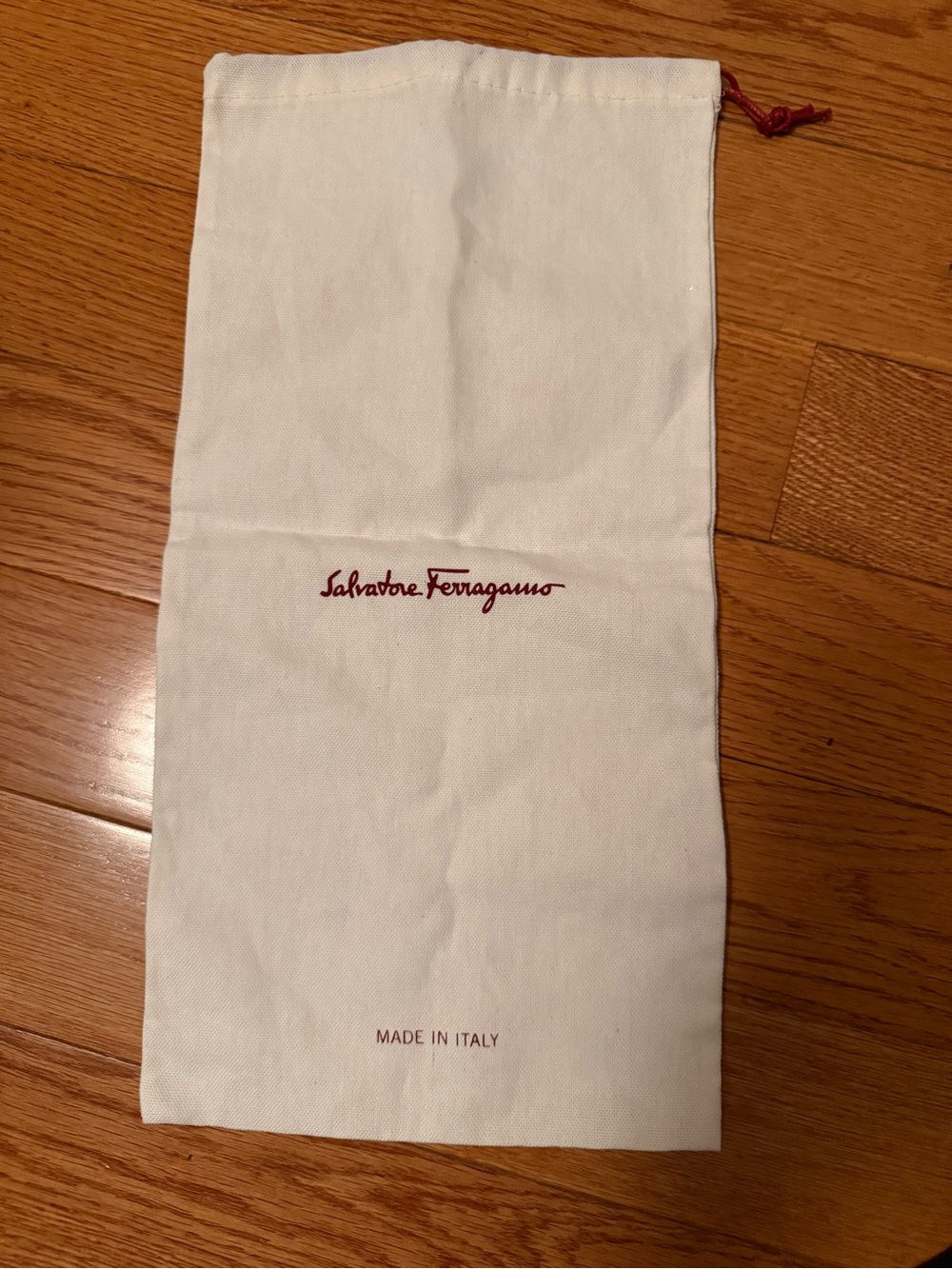 Salvatore Ferragamo White Dust Pouch with Red Logo.
